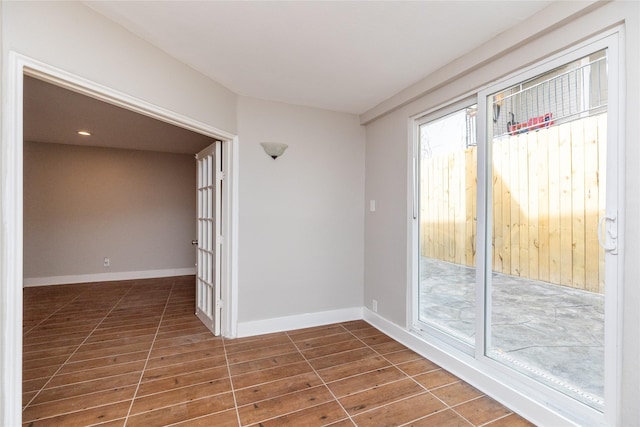 unfurnished room with dark hardwood / wood-style floors