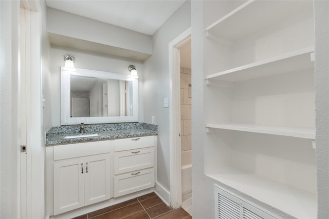 bathroom featuring vanity and shower / bath combination