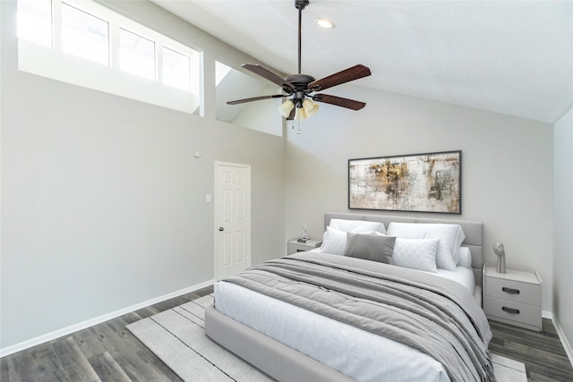 bedroom featuring dark wood-type flooring, ceiling fan, and lofted ceiling