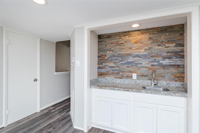 bathroom with hardwood / wood-style flooring and sink