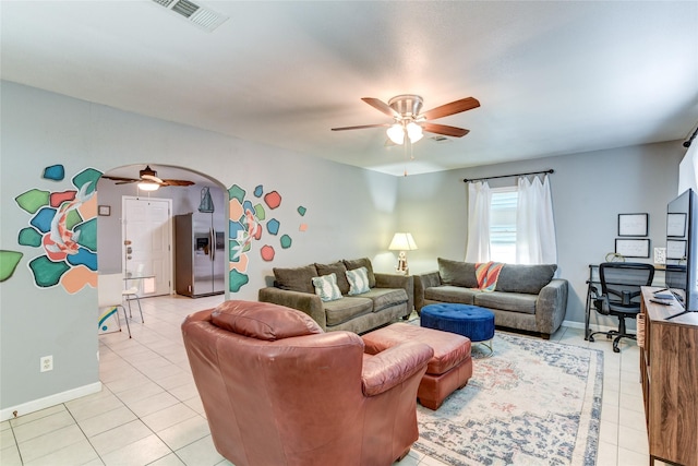 tiled living room featuring ceiling fan