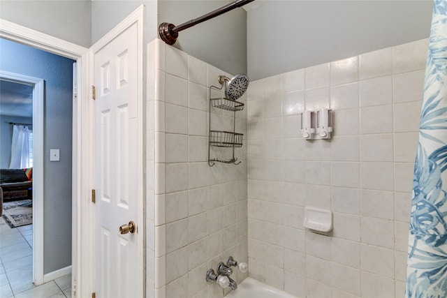 bathroom with tile patterned flooring and shower / bath combo