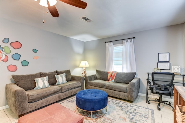 tiled living room featuring ceiling fan