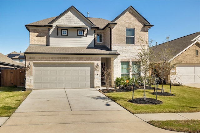 view of front of property with a garage and a front lawn