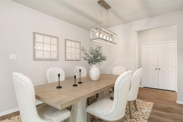 dining area with wood-type flooring