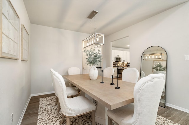 dining area with wood-type flooring