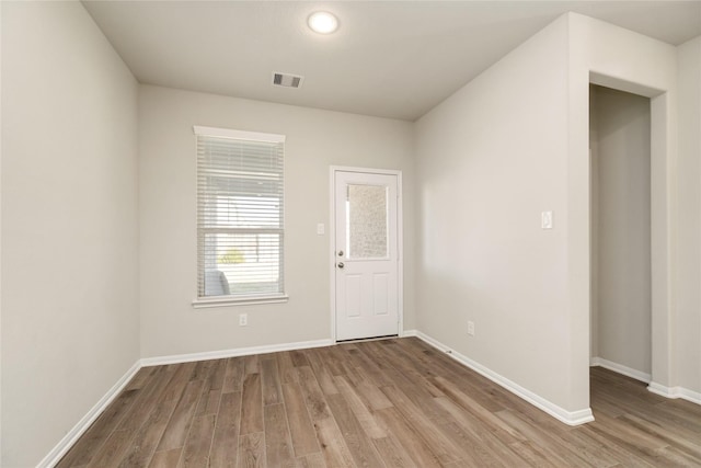 spare room with light hardwood / wood-style floors