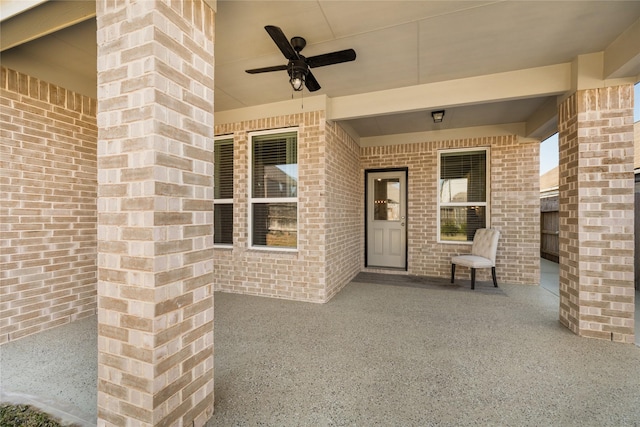 doorway to property with ceiling fan and a patio area