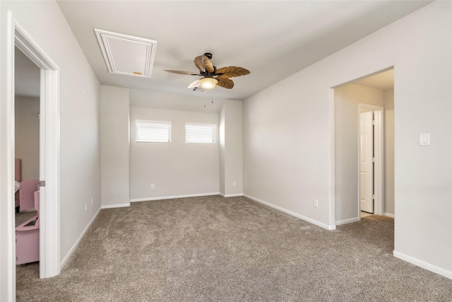 carpeted spare room featuring ceiling fan