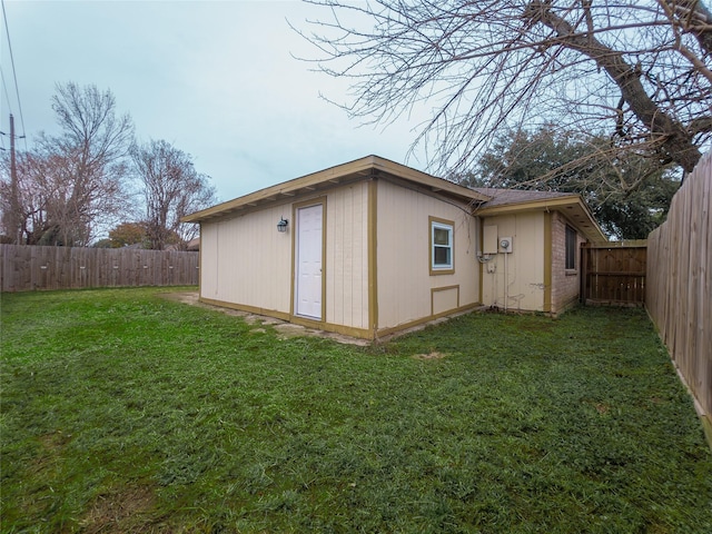 view of outdoor structure with a lawn