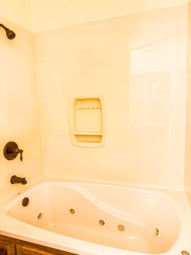 bathroom with a tub to relax in