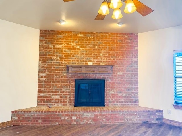 unfurnished living room with hardwood / wood-style floors and ceiling fan