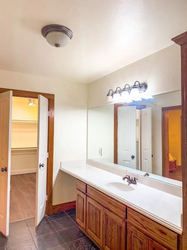 bathroom with vanity and tile patterned flooring