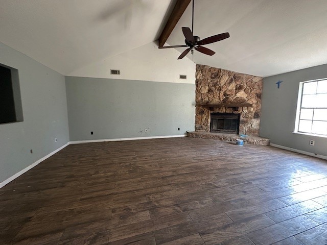 unfurnished living room with high vaulted ceiling, a fireplace, dark hardwood / wood-style flooring, ceiling fan, and beam ceiling