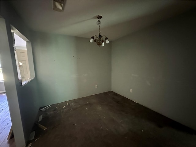 unfurnished dining area with a notable chandelier