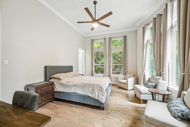 bedroom with crown molding, vaulted ceiling, light hardwood / wood-style floors, and ceiling fan