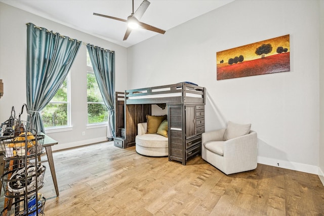 bedroom featuring hardwood / wood-style flooring and ceiling fan