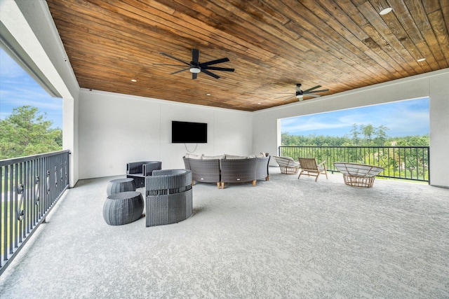 view of patio / terrace featuring a balcony, outdoor lounge area, and ceiling fan