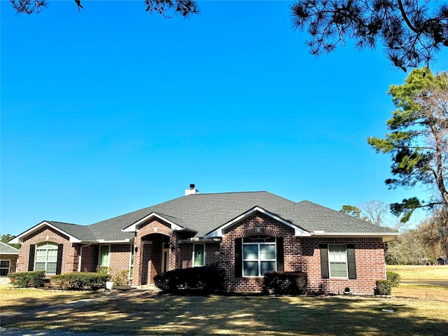 ranch-style home with a front yard