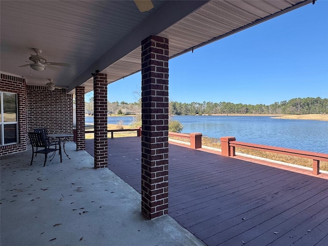 view of dock with a deck with water view