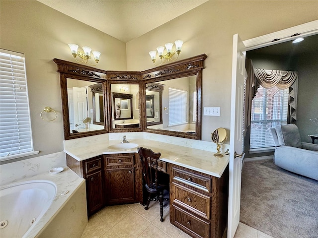 bathroom featuring tile patterned floors, vanity, and a bathtub