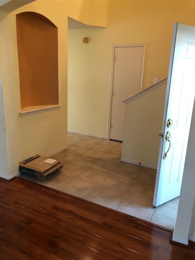 corridor with tile patterned flooring