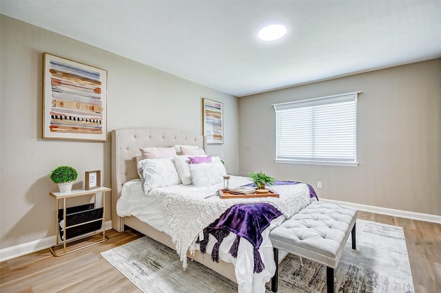 bedroom with hardwood / wood-style flooring