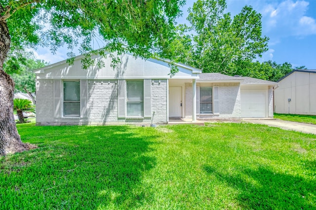 view of front of home with a garage and a front yard