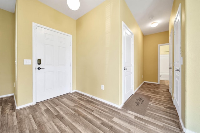 foyer entrance with light hardwood / wood-style flooring