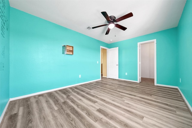 unfurnished bedroom with ceiling fan and light hardwood / wood-style floors