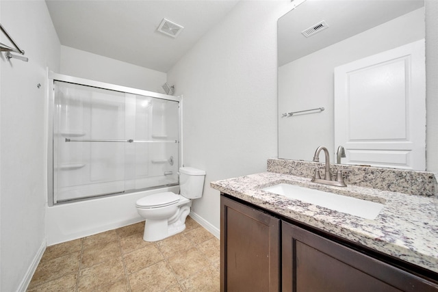 bathroom featuring visible vents, toilet, vanity, and combined bath / shower with glass door