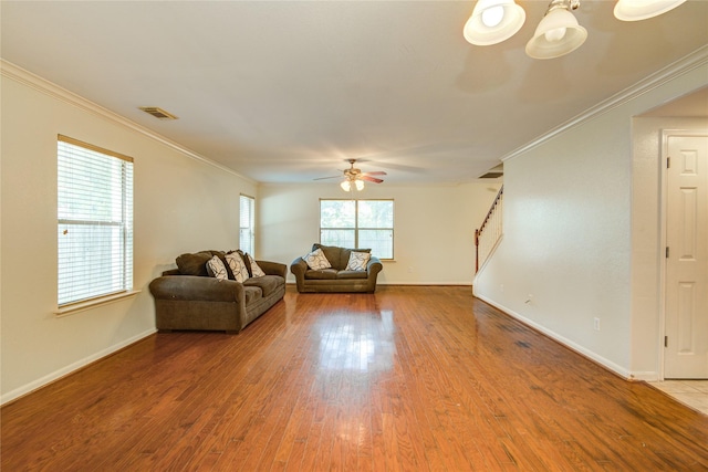 unfurnished living room featuring ornamental molding, hardwood / wood-style floors, and ceiling fan