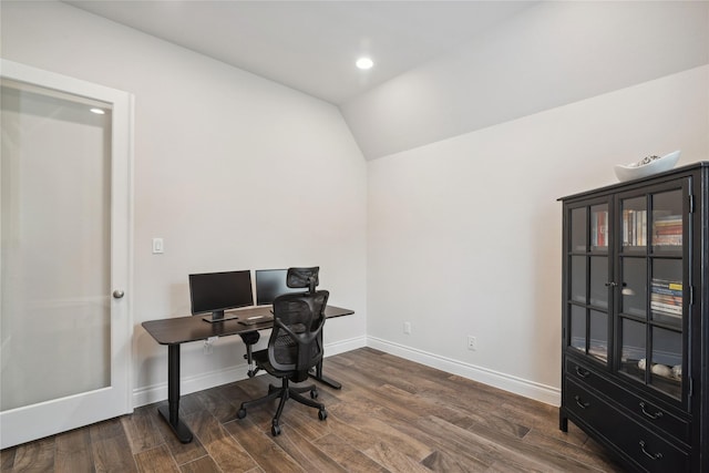 home office featuring dark hardwood / wood-style flooring and vaulted ceiling