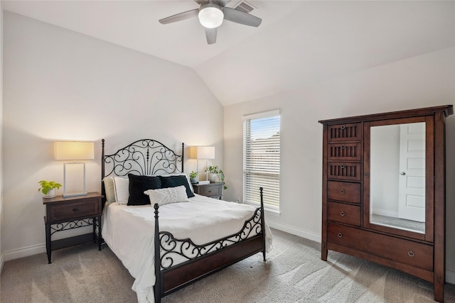 bedroom with lofted ceiling, ceiling fan, and carpet