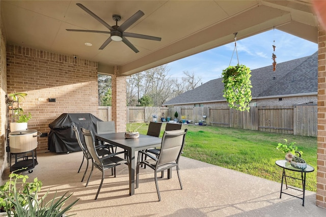 view of patio featuring a grill and ceiling fan