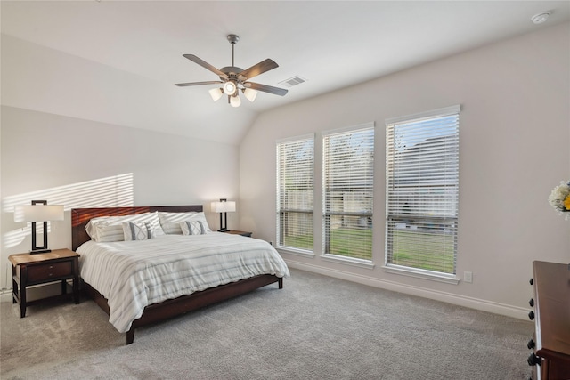 bedroom featuring lofted ceiling, ceiling fan, and carpet