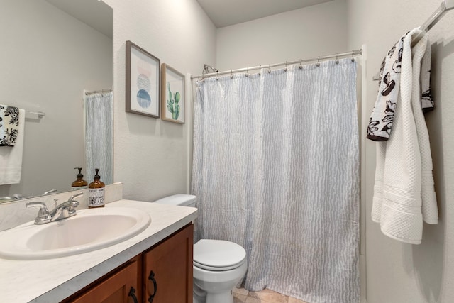 bathroom featuring vanity, curtained shower, and toilet