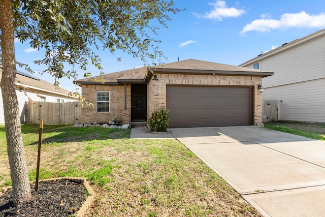 single story home with a garage and a front lawn