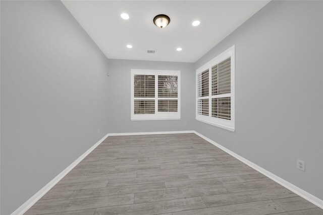 unfurnished room featuring light wood-type flooring