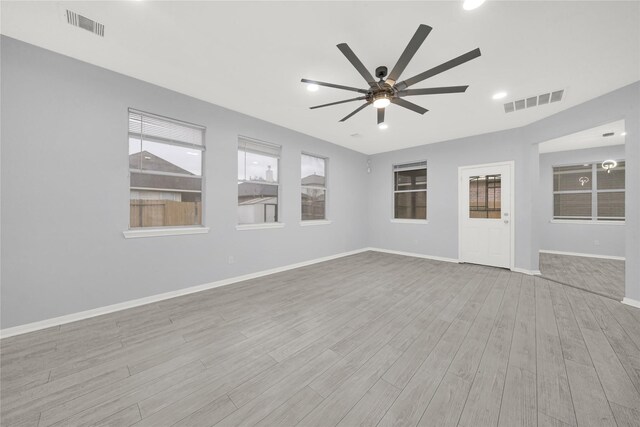 unfurnished room featuring ceiling fan and light wood-type flooring