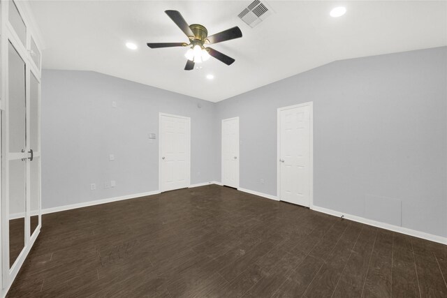 unfurnished bedroom with dark wood-type flooring, ceiling fan, and lofted ceiling