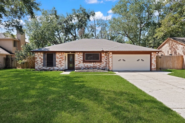 single story home featuring a garage and a front yard