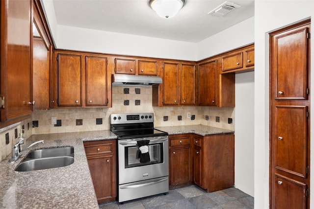 kitchen with tasteful backsplash, stainless steel electric stove, sink, and light stone counters