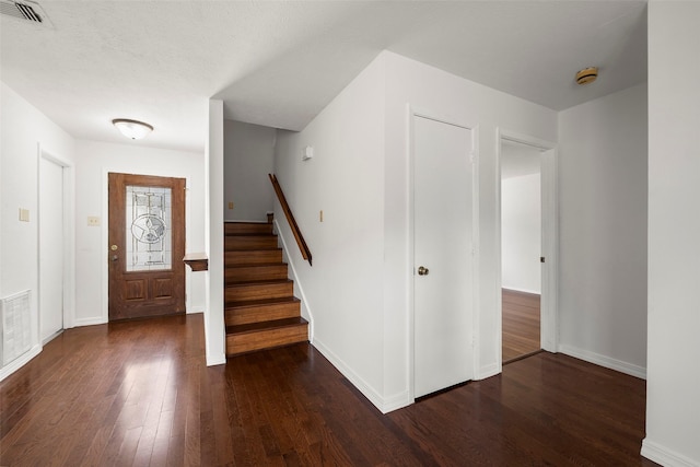 entrance foyer featuring dark hardwood / wood-style floors