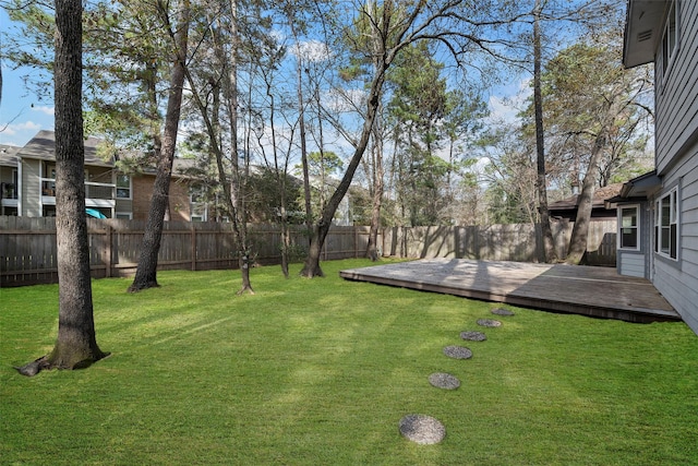 view of yard with a wooden deck