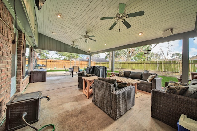 view of patio with grilling area, an outdoor hangout area, and ceiling fan