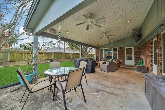 view of patio / terrace featuring area for grilling, an outdoor living space, and ceiling fan