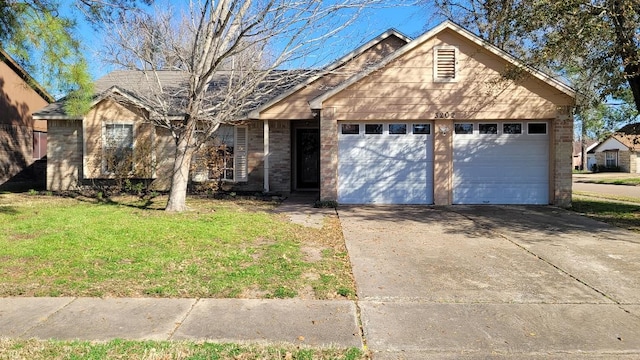 ranch-style home with a garage and a front yard