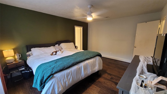 bedroom with dark wood-type flooring and ceiling fan