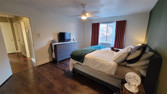 bedroom featuring ceiling fan and dark hardwood / wood-style flooring